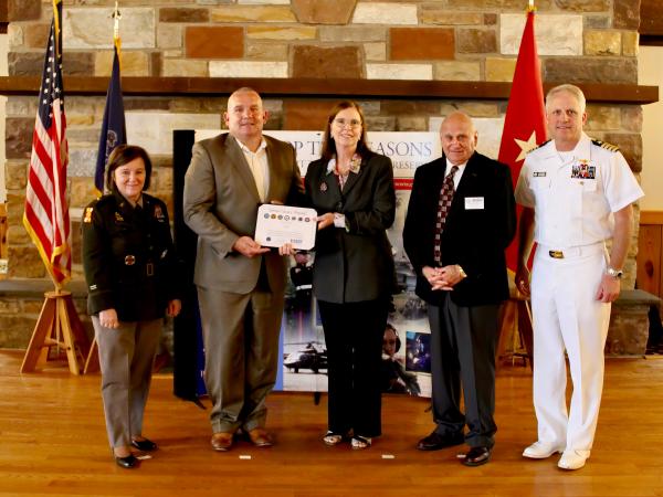 The CAES team receives the Seven Seals award